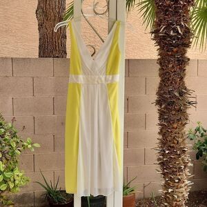 Alyn Paige canary yellow and white flowy sleeveless dress
